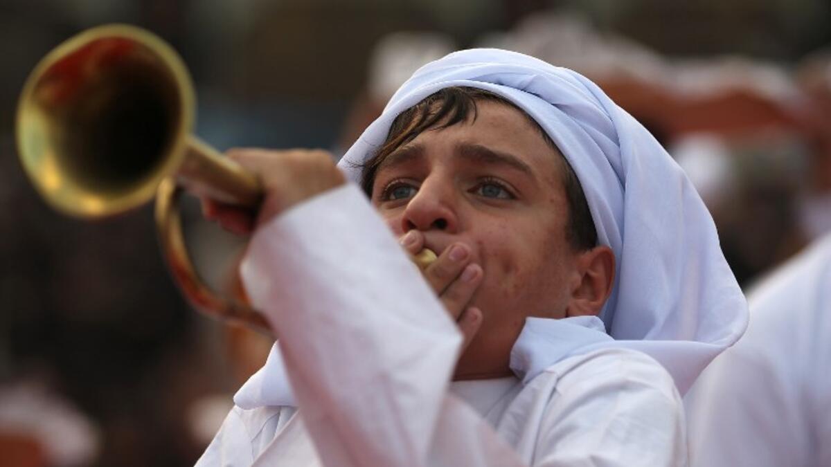 Shiite pilgrims take part in the preparations of the Ashura ceremony in Karbala, about 80 kilometres (50 miles) southwest of Baghdad on September 18, 2018. AHMAD AL-RUBAYE / AFP