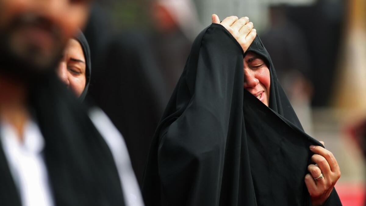 Shiite pilgrims take part in a ceremony during the ten-day mourning period leading up to Ashura, on September 19, 2018 in Iraq's holy city of Karbala. AHMAD AL-RUBAYE / AFP