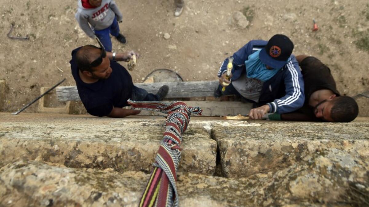 Experts and students from Algiers University’s Archaeology Institute work on one of the Jeddars pyramid tombs.
RYAD KRAMDI / AFP