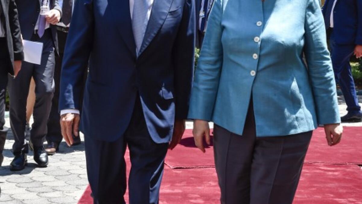 Lebanese Parliament Speaker Nabih Berri (L) receives German Chancellor Angela Merkel during her visit to Beirut, June 22, 2018. 
(AFP/Stringer)