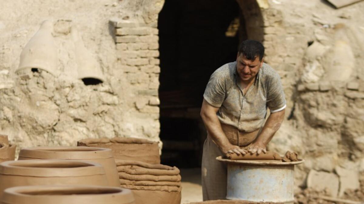 Iraqis making clay pots in Najaf on November 11, 2018. Pottery has deep roots in Iraq, where ancient civilisations turned to clay to build their homes, shape their cooking utensils, and even make their ovens.
Haidar HAMDANI / AFP