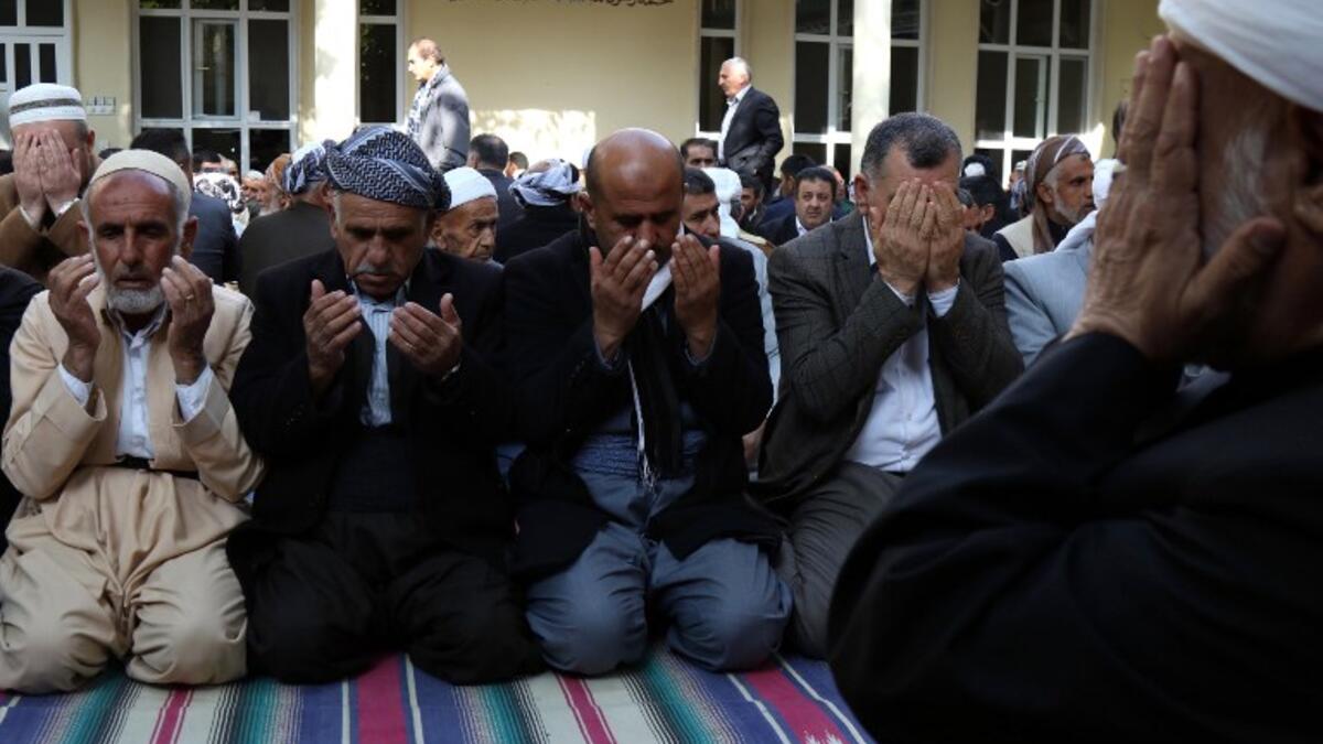 Iraqi Sufi Muslim Kurds join in prayer to commemorate the birth of the Prophet Mohammed in the Kurdish town of Akra.
SAFIN HAMED / AFP