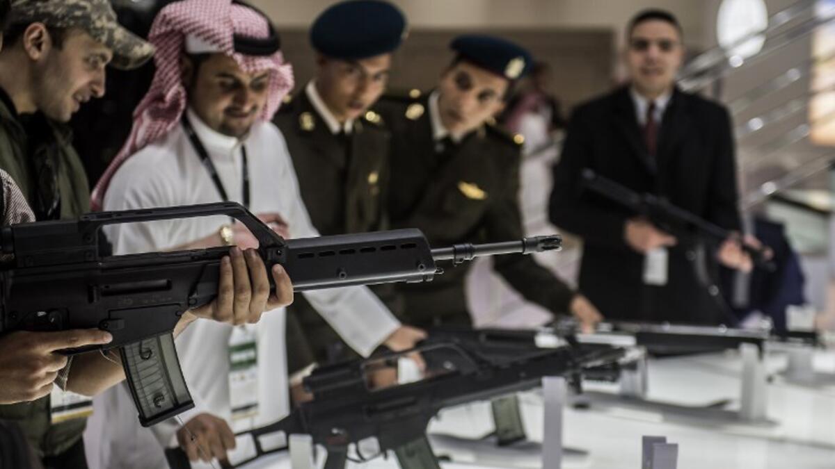 A visitor aims a weapon at the Saudi stand during Egypt’s first Service Defence Exhibition in Cairo on December 3, 2018, at the International Exhibition Center. 
Khaled DESOUKI / AFP