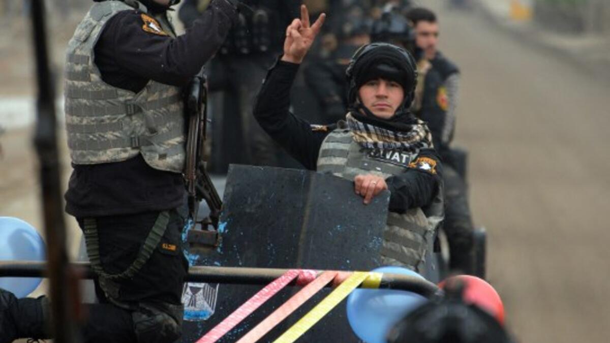 Members of the Iraqi security forces parade in the streets of the Iraqi city of Mosul, during celebrations marking the first anniversary of the country's victory over the Islamic State (IS) group, on December 10, 2018.
Zaid AL-OBEIDI / AFP