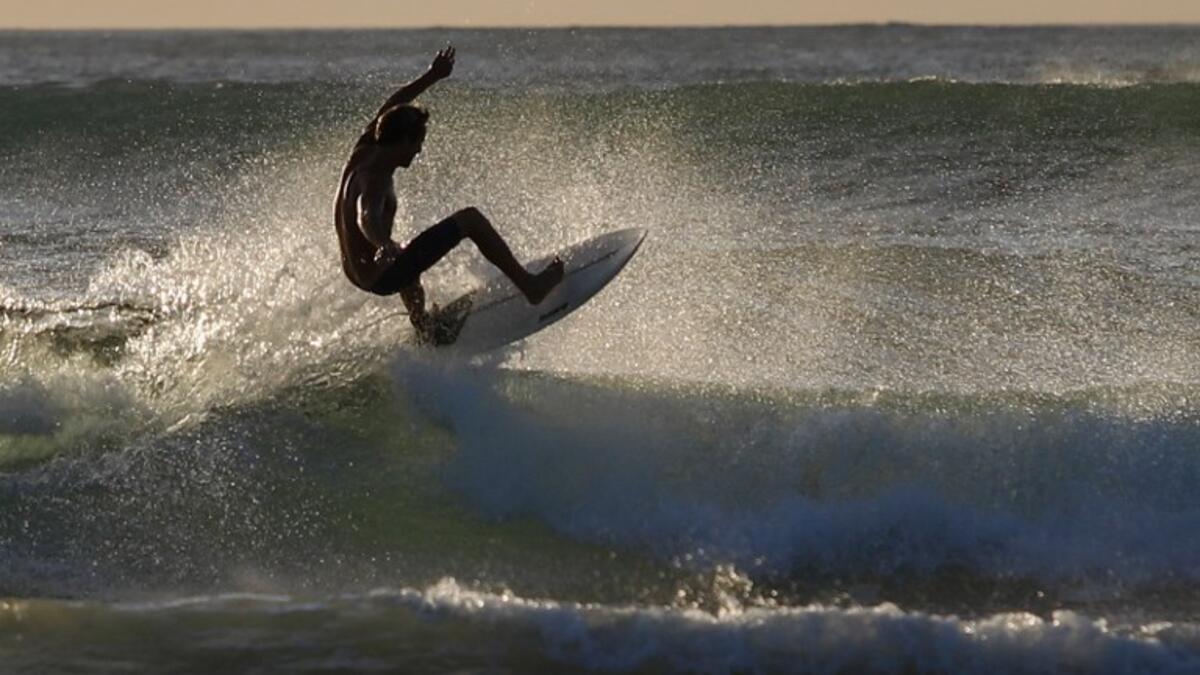 A surfer enjoys the waves at Las Baulas National Marine Park, Playa Grande, Costa Rica on December 10, 2018. David GANNON / AFP