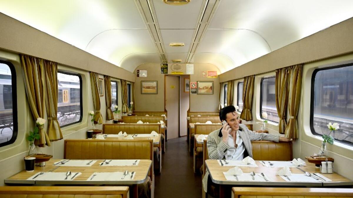 An Elvis fan sits on a train after leaving Central station to head to The Parkes Elvis Festival, in Sydney on January 10, 2019. The Parkes Elvis Festival is an annual event celebrating the music and life of Elvis Presley in the New South Wales town of Parkes.
PETER PARKS / AFP