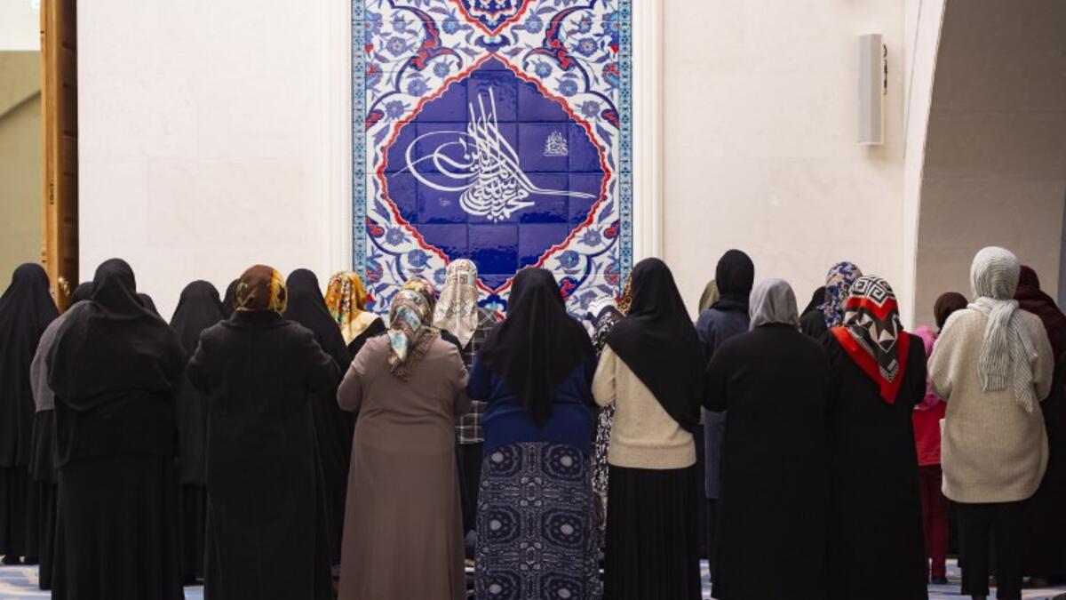 Female worshippers attend early morning prayers at the Camlica Mosque in Istanbul, which opened on March 7, 2019. 
Yasin AKGUL / AFP