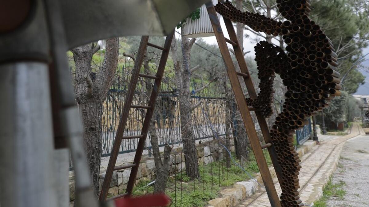 In a celebration of tradition and memory, artist Charles Nassar has been transforming the dark, wrangled remains into sculptures. "I hate shrapnel, but I also love it at the same time," said the 54-year-old sculptor with a neat salt-and-pepper beard, from a garden south of Beirut.
JOSEPH EID / AFP