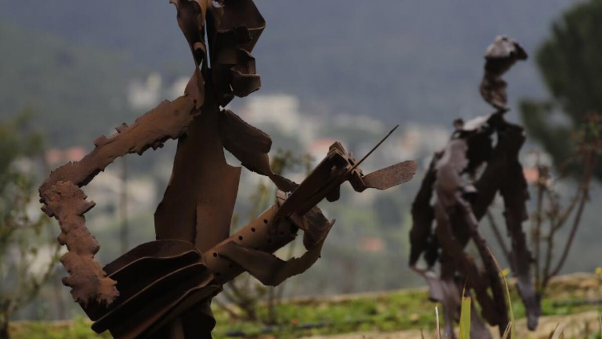 In a celebration of tradition and memory, artist Charles Nassar has been transforming the dark, wrangled remains into sculptures. "I hate shrapnel, but I also love it at the same time," said the 54-year-old sculptor with a neat salt-and-pepper beard, from a garden south of Beirut.
JOSEPH EID / AFP
