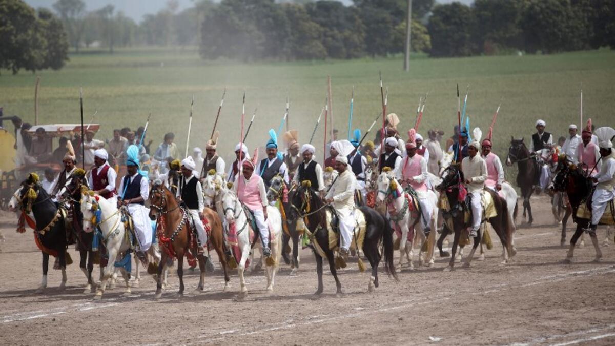 This photograph taken on March 27, 2019, shows Pakistani horse riders during an attempt for a Guinness World Record for tent pegging in Khanewal district in Punjab province.
SS MIRZA / AFP