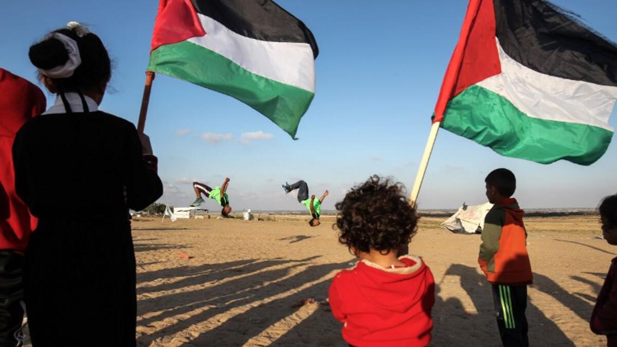 Everyone joins in the fun. Young and old watch. April 10, 2018. SAID KHATIB / AFP