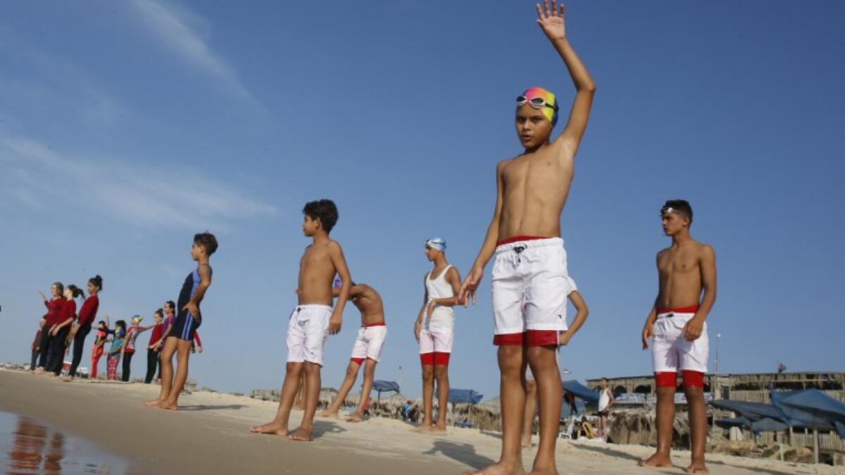 Aged between 11 and 16, they make up a rare swimming club in the Gaza Strip, and perhaps its only mixed-sex one. (SAID KHATIB / AFP)