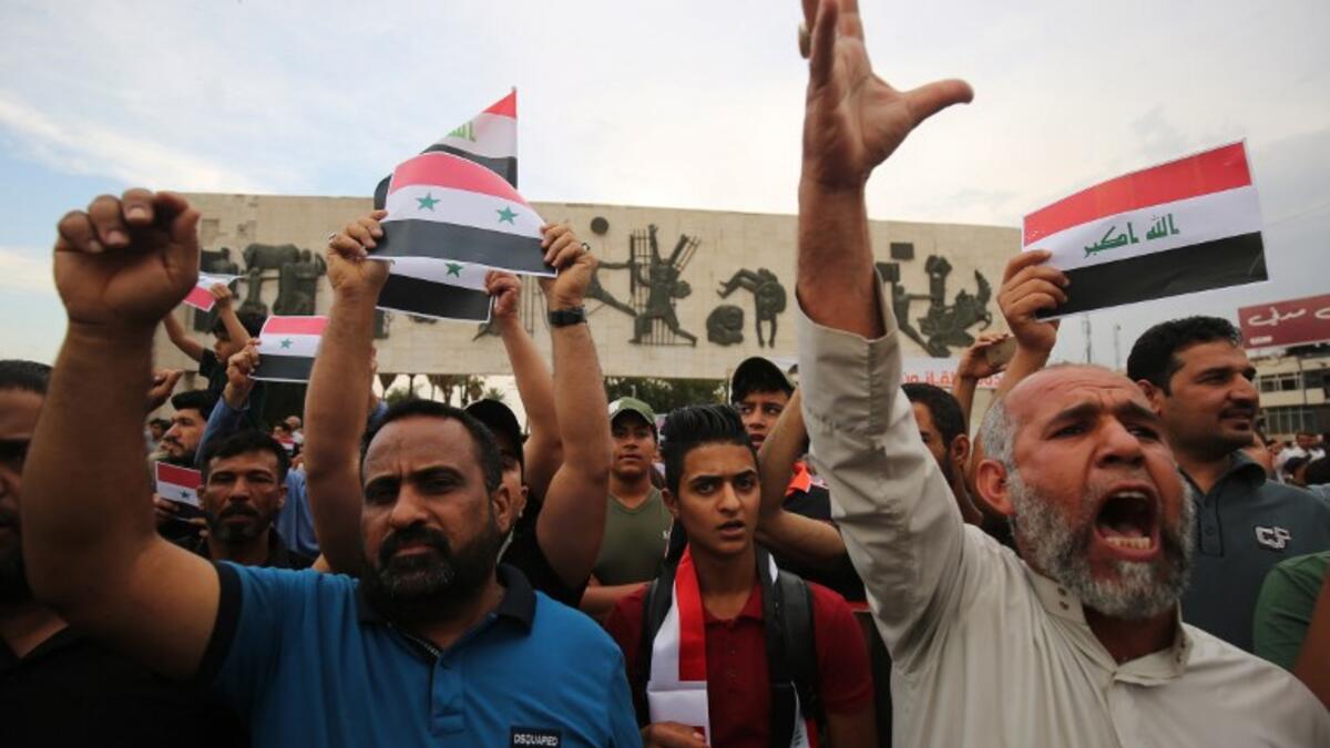 Angry men take to Baghdad’s Tahir Region on April 15, 2017 chanting against the western military strikes on Syria AHMAD AL-RUBAYE / AFP