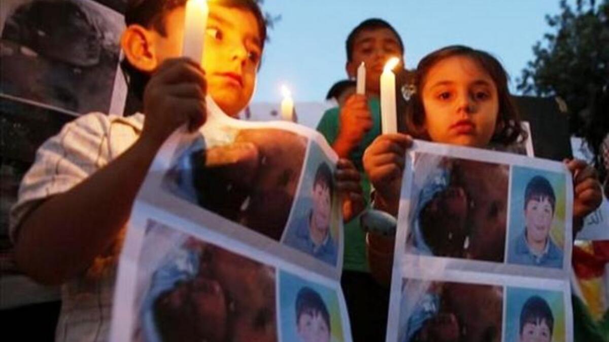 Syria's poster child: Hamza Ali al-Khateeb a round-faced 13 year-old boy vanished from a protest in April, only to show up a month later as a mutilated corpse. His battered purple face and gashed, burn-marked, 
bullet-ridden skin speak of torture before death. His penis was had been chopped off.