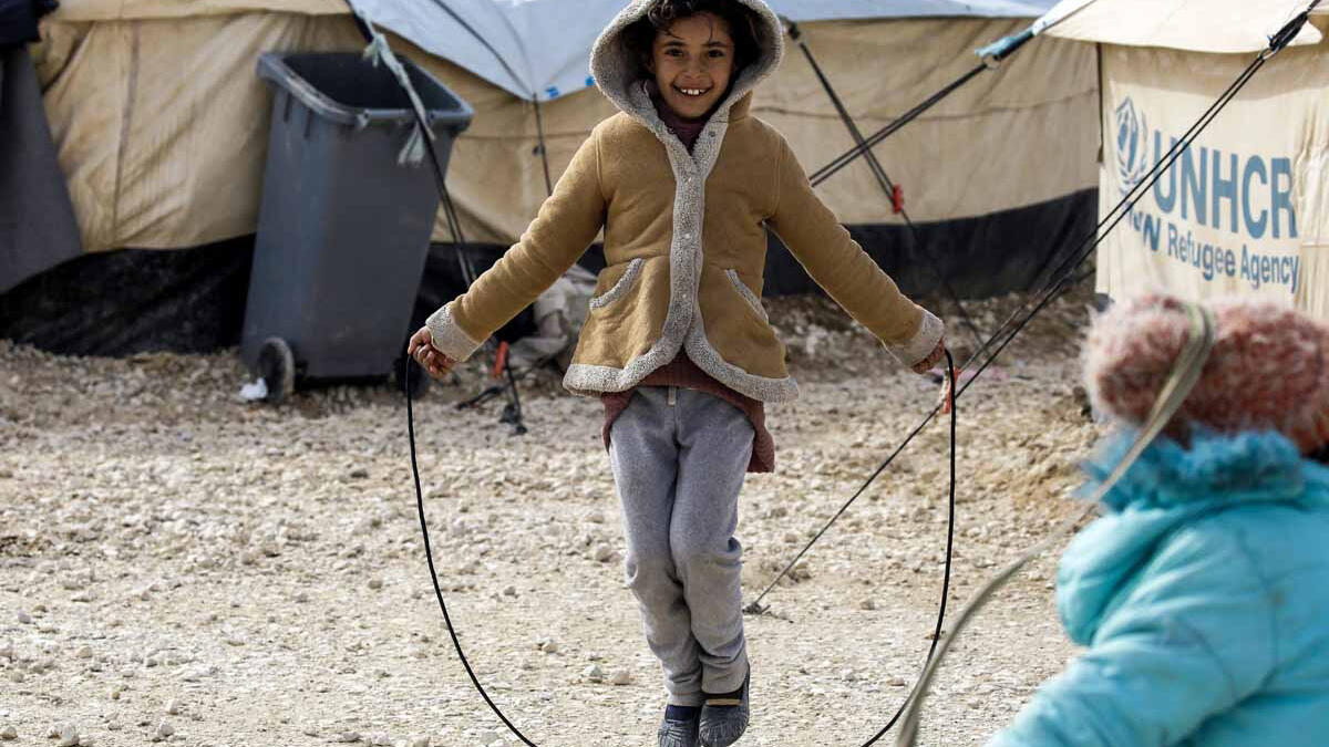 A displaced Syrian child fleeing from Deir Ezzor city besieged by Daesh plays with a skipping rope. As a result of the Syrian crisis, some 2.5 million are living as refugee children in neighbouring countries. These children have lost their homes, schools and communities but do not give up on finding happiness in the small things that remain.