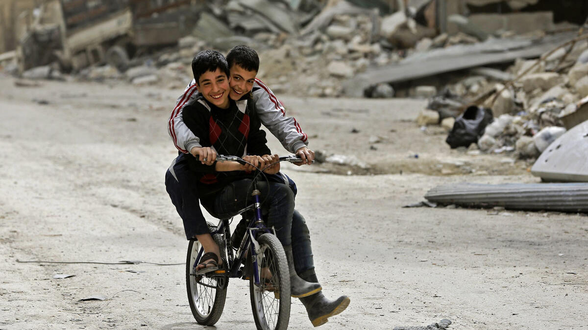 Two children playing on their bikes in the ruins of the Shaar district, Aleppo. The battle for Aleppo, which ended with the Syrian government’s recapture of city in December 2016, was one of the most devastating battles in the Syrian civil war. It left around 31,000 people dead, displaced thousands and caused severe damages to the old city.