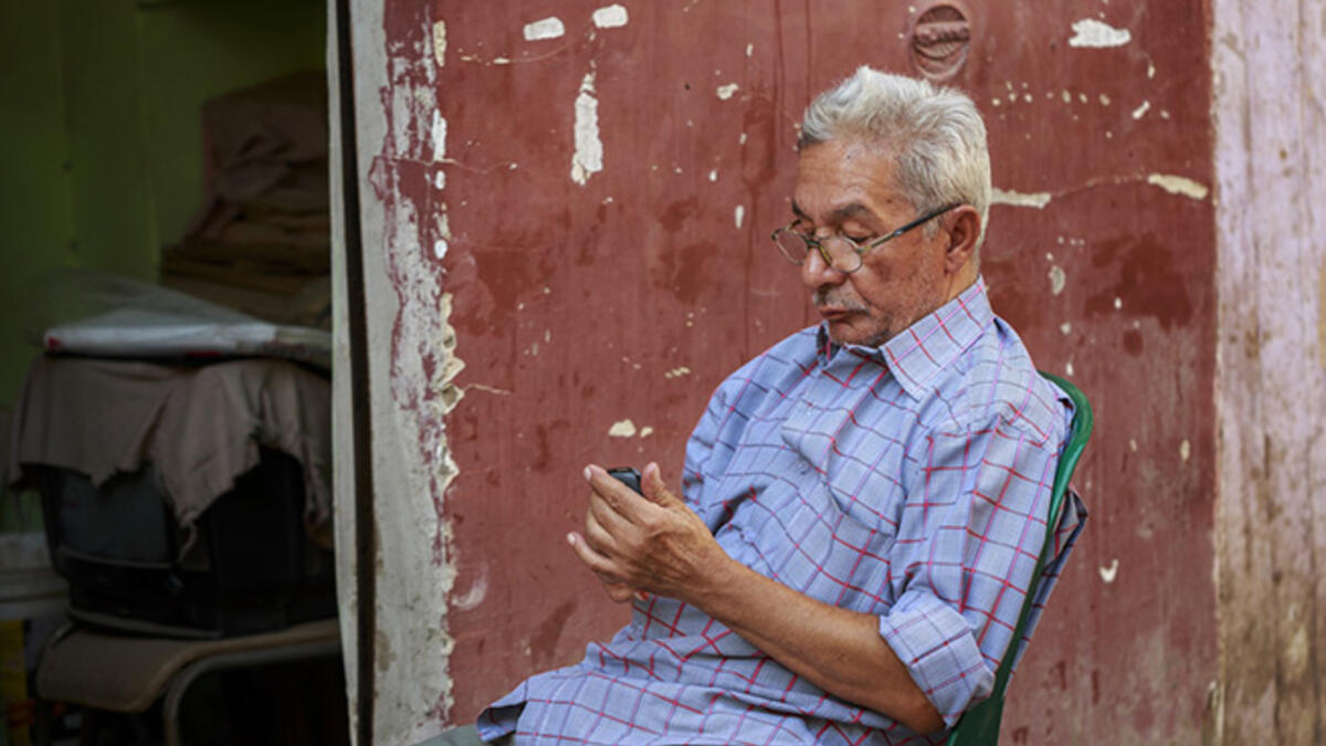 The resident Men in Chairs. Usually hired as “security” or parking lot attendants, these guys can usually be seen sitting in a chair - often missing a leg - on the sidewalk, scowling and muttering at passersby. Sometimes their chair is strategically placed in the street to keep people from parking in front of a store.
