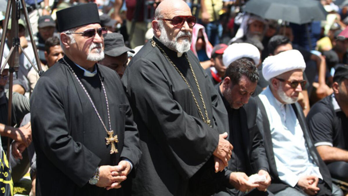 Iraqi Christians take part in Friday prayer in the Karrada neighborhood of Baghdad in July 2016, after a massive bombing killed nearly 300 people during Eid al-Fitr after Ramadan. The suicide attack targeted Shia worshippers, but killed Iraqis of all faiths and walks of life.