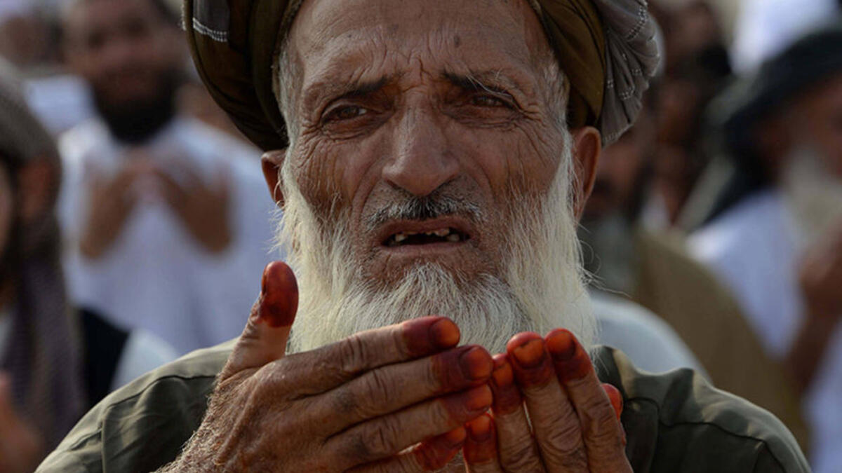 An Afghan resident offers prayers at the start of the Eid el-Fitr holiday at open air mosque on the outskirts of Jalalabad on June 25, 2017. Afghanistan has witnessed the deadliest Ramadan since 2001, with 200 people killed and hundreds wounded. This year, many people have avoided large public gatherings out of fears for further attacks.