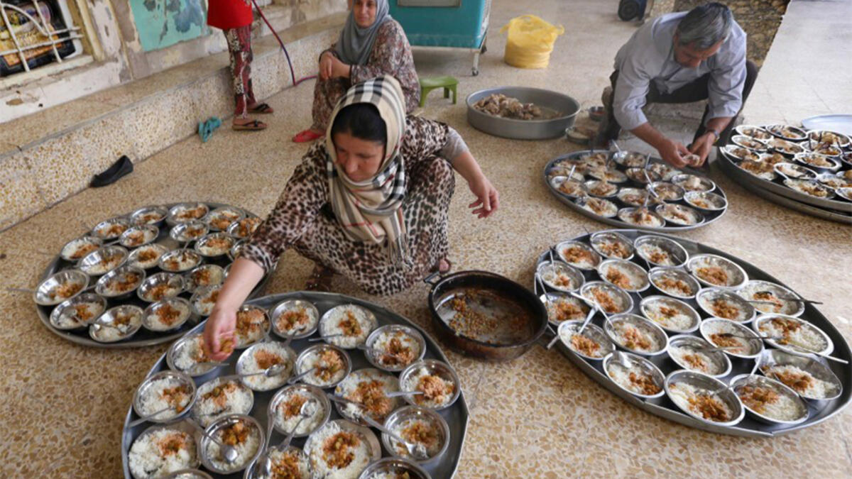 Providing charities, known as Zakat, is an integral part of Ramadan and one of the five pillars of Islam. Here, an Iraqi Kurdish woman prepares the Iftar for families who fled the violence Northern Iraq.