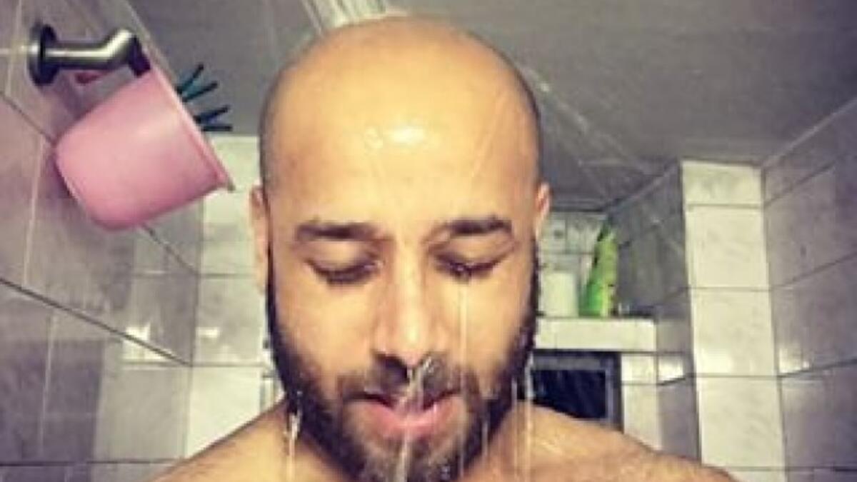 bald man in shower