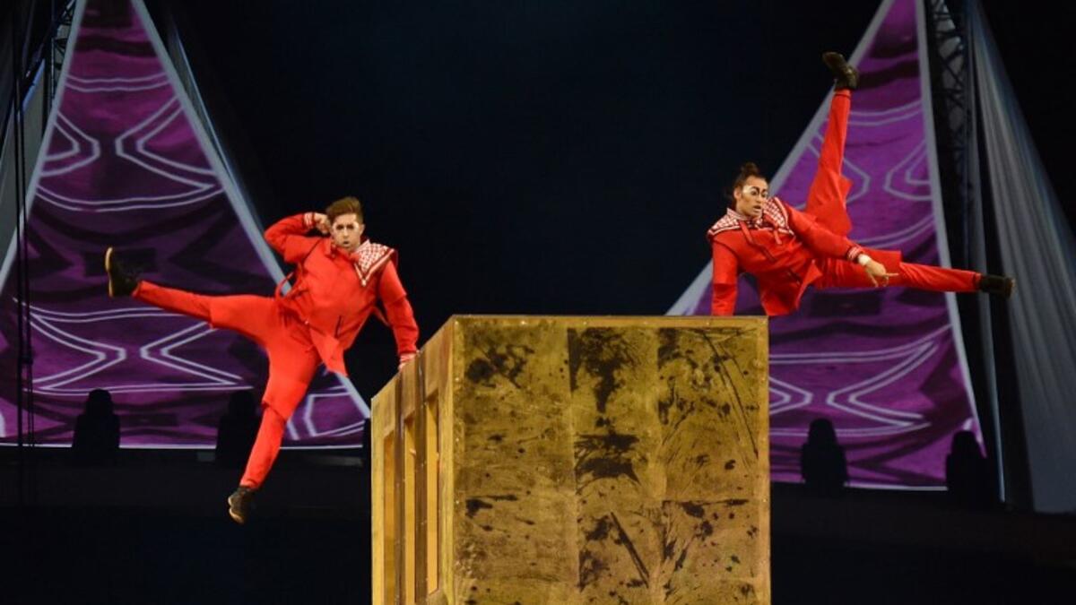 Members of the Canadian circus troop Le Cirque du Soleil perform a show as a part of celebrations of the 88th Saudi National Day at the King Fahad stadium on September 23, 2018 in Riyadh. (FAYEZ NURELDINE / AFP)