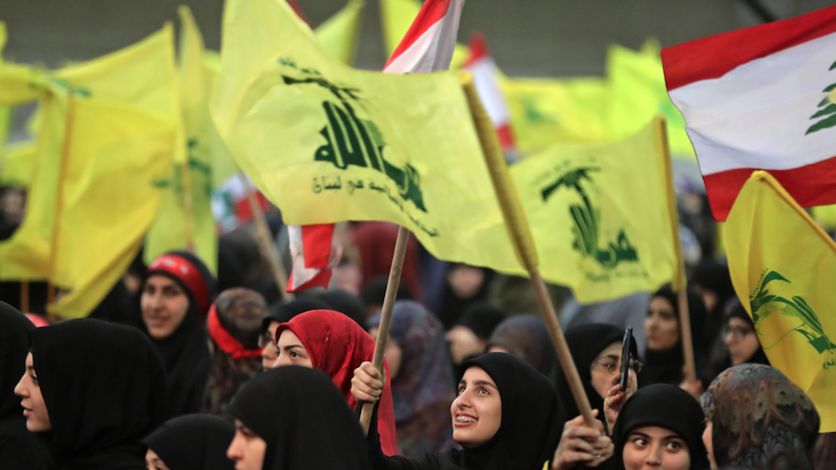 Supporters of Lebanese Hezbollah Leader gather as he delivers a televised speech during a ceremony held by the Shiite party in the capital Beirut, commemorating the party's killed leaders, on February 16, 2018. 
(JOSEPH EID / AFP)
