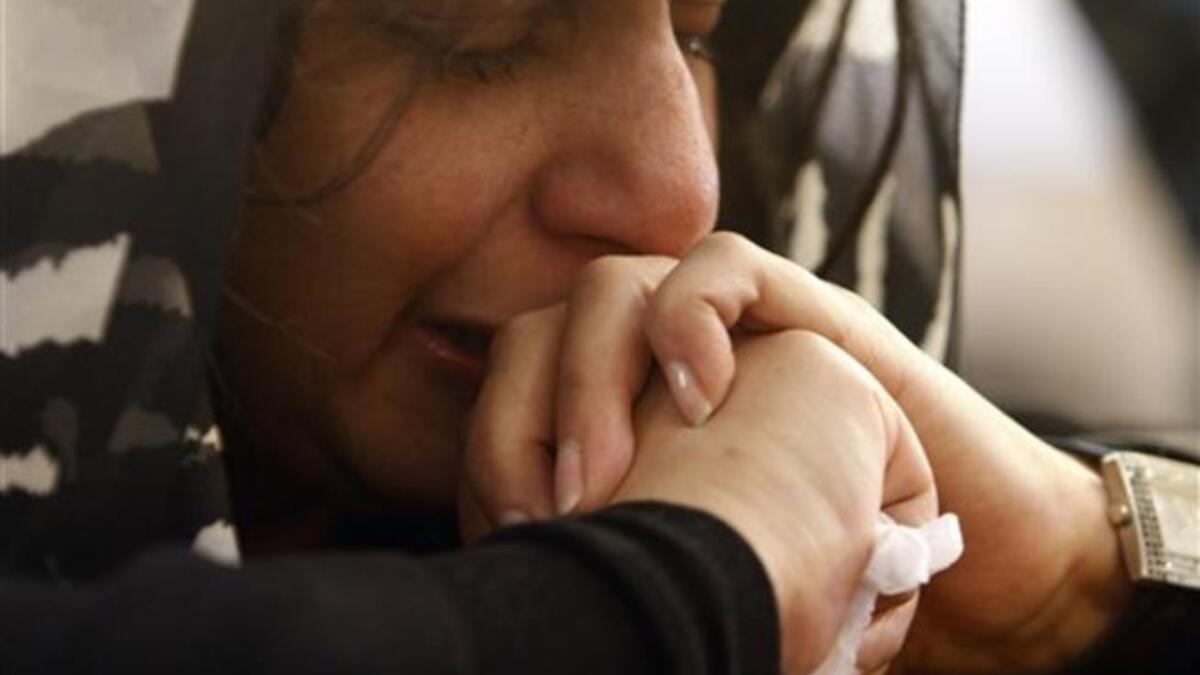 An Egyptian Coptic Christian mourns during Sunday mass at the Al-Qiddissine church.