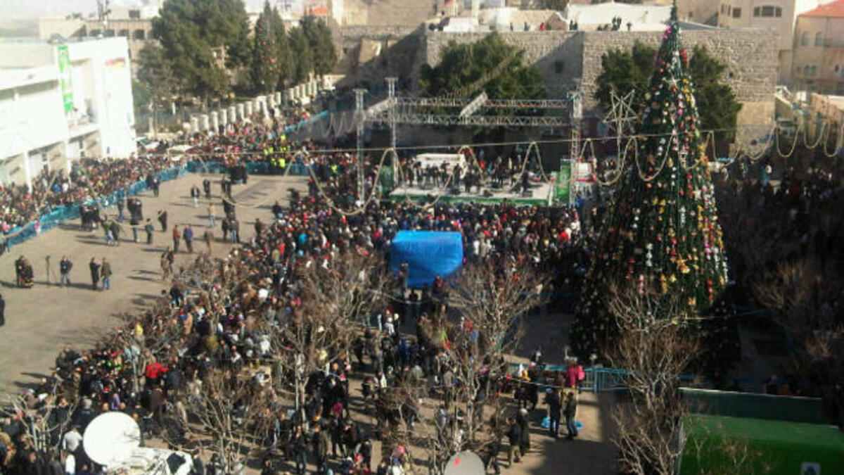 Bethlehem, West Bank of Palestine, 2011: The traditional birthplace of Christ the Savior attracts pilgrims and indigenous Arab Christians alike for public Christmas celebrations. In private, the whole family gathers in the house of the eldest male member, be it grandfather or the eldest son, and enjoys a meal rich in meat, fruits and vegetables.