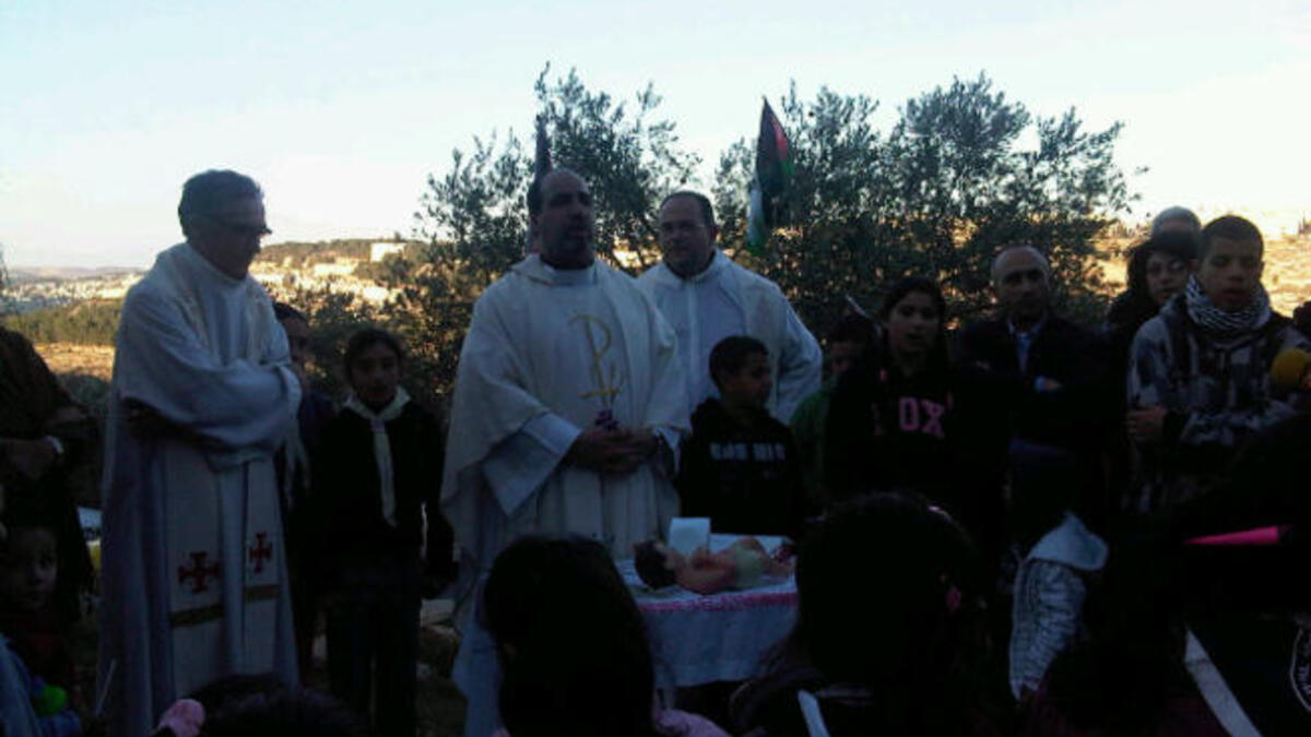 The nativity tradition is imbued with heightened spiritual significance when practiced in its original Palestine setting.
The West Bank town of Bethlehem held its Christmas Eve celebrations Saturday, delivering  warm blessings to the traditional birthplace of Jesus on a wintery, wet night.