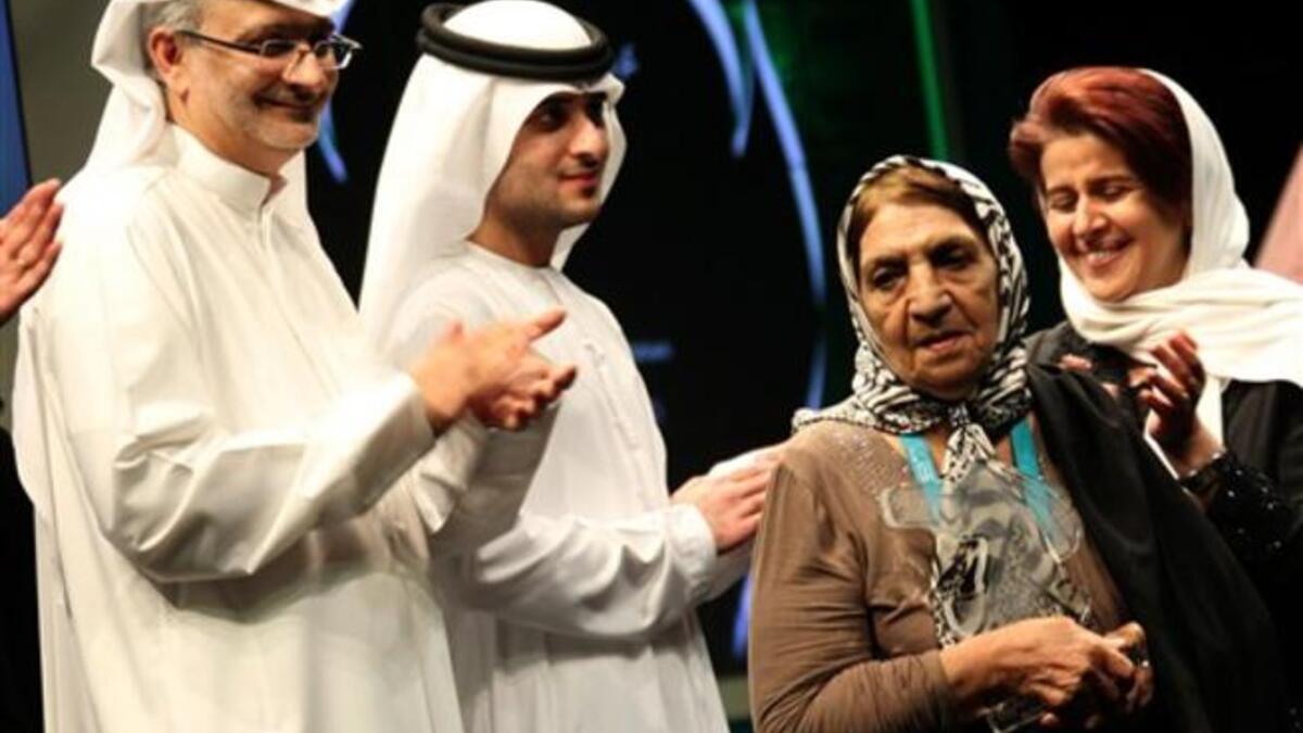 Kobra Hasanzadeh Esfahani (2nd R) of Iran receives the Muhr AsiaAfrica best actress award for her role in Alireza Davoodnejad's film Salve.