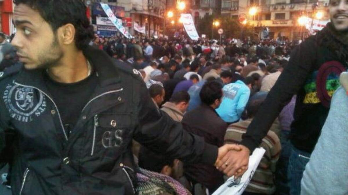 Copts protect Muslim countrymen: Tahrir undivided. The iconic image of Christians forming a human shield around Muslim worshippers during Friday prayers to protect them from pro-Mubarak thugs reminds us of a dream still to be realized. Since the ouster, the news is strewn with burning churches & intense violence between Muslim & Christian.