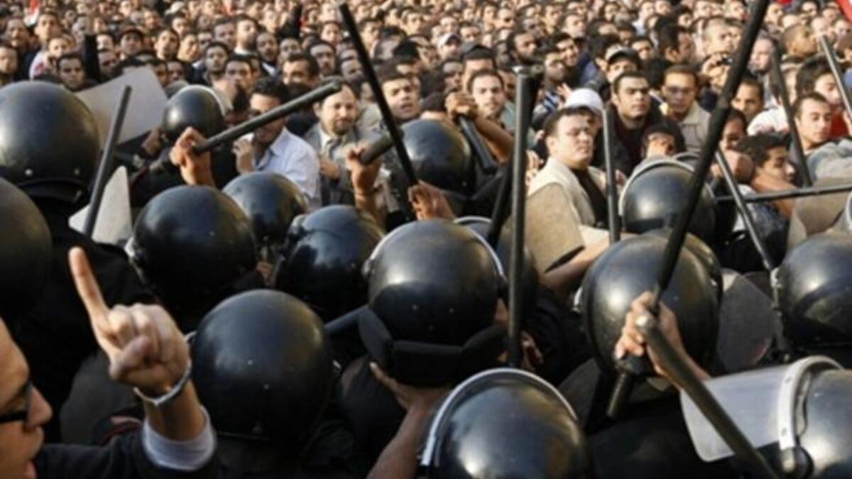 Egyptian demonstrators clash with the Egyptian police.