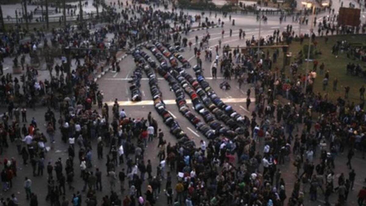 Egyptian demonstrators pray in central Cairo during the demonstration.