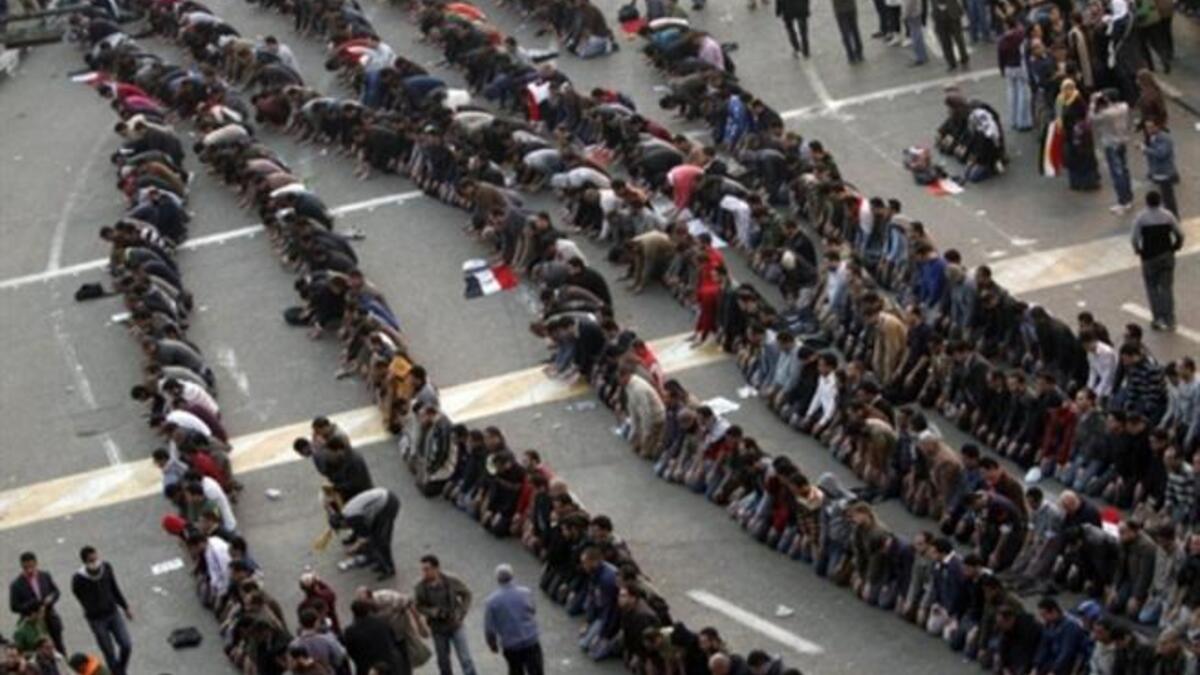 A closer shot to the demonstrators praying in central Cairo.