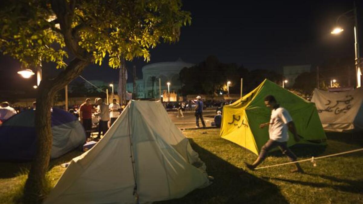 Opponents to Egypt's Islamist President set up tents in front of the Egyptian presidential palace during a sit-in in Cairo (AFP)
