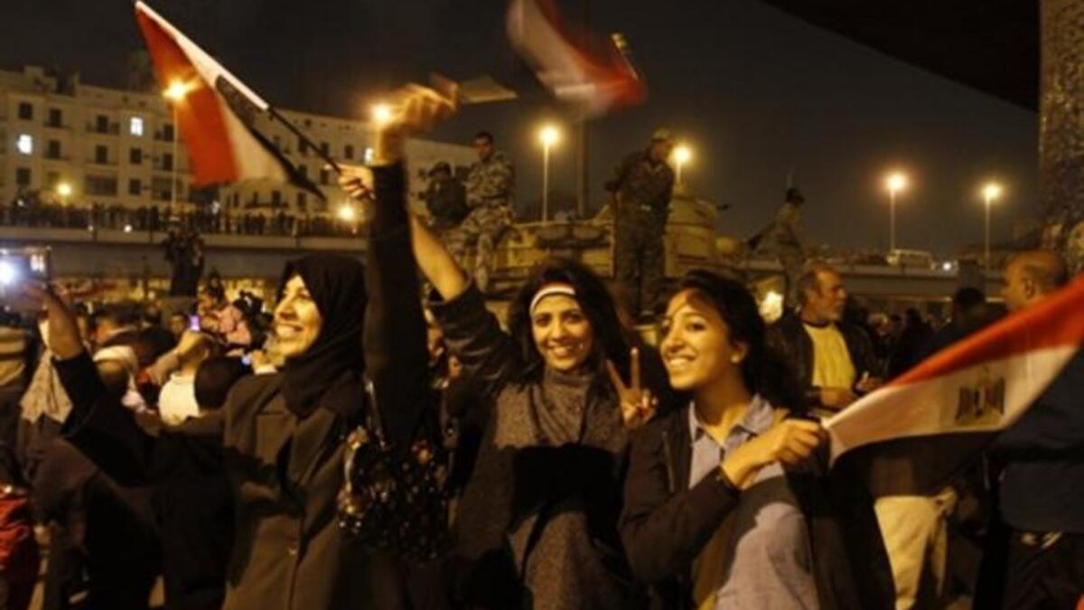 Egyptians celebrate the ousting of Mubarak in Cairo on the night of Friday, February 11, 2011