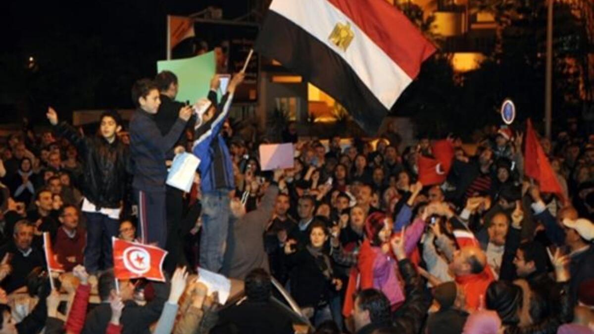 Tunisians, doubly jubilant after their own barely month-old victory pioneering- leaving- leader-  celebrating the latest candidate for resignation from power from the Egyptian embassy in Tunis.