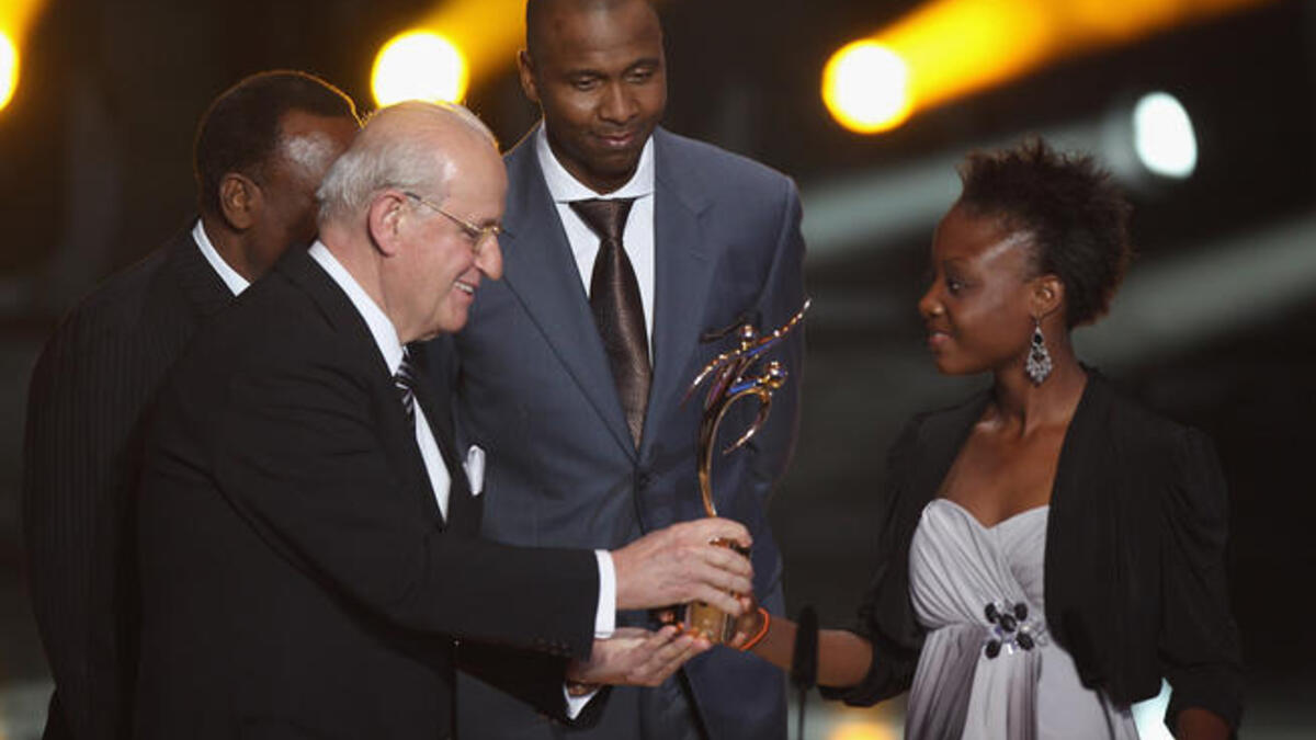 Jean-Francois Hayana (R) captain of the Haiti women's U17's team receives the Fifa Fair Play award.