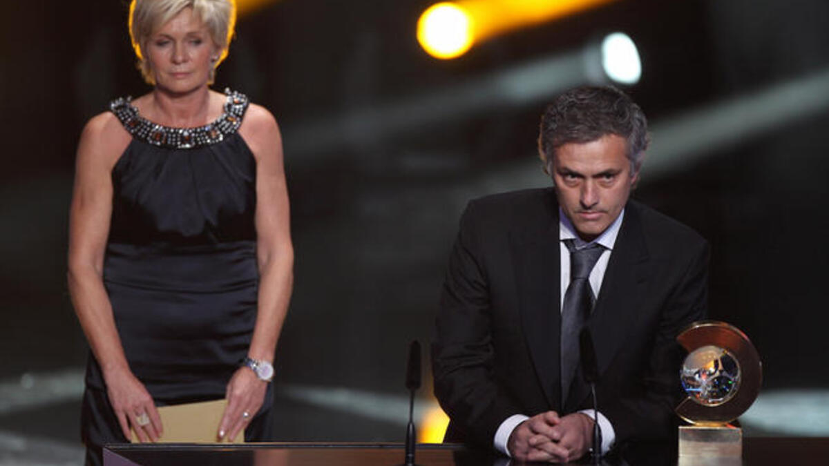 Jose Mourinho (R) of Portugal receives the coach of the year award alongside Silvia Neid of Germany winner of the women's coach of the year award.