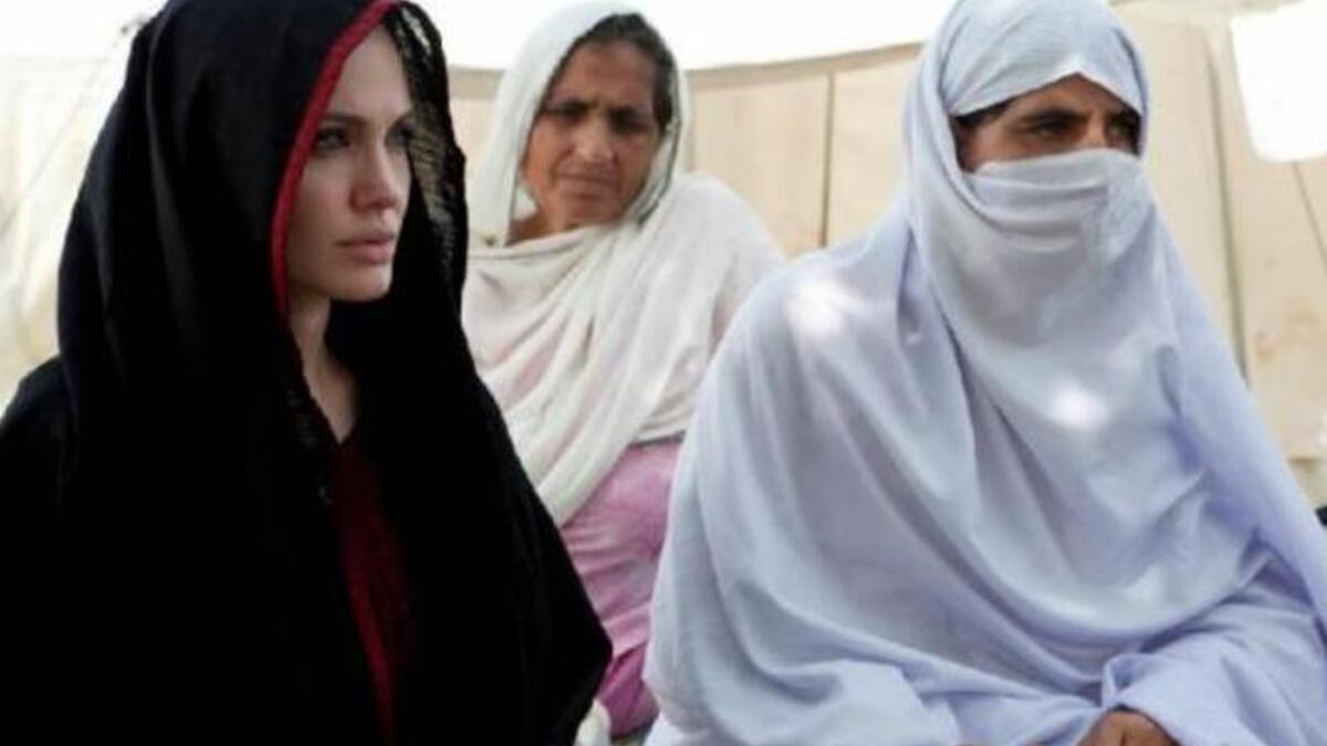 Angelina Jolie, 'Mother Teressa' to World Refugees, spent time in Ramadan, 2010, in a Pakistan refugee camp - donating
generously to refugees. While she would have donned the traditional head scarf any time of 
year, she took extra care to veil her whole head during this symbolically Muslim month.