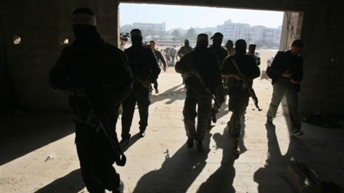 Armed Palestinians are seen giving a press conference to mark the second anniversary of Israel's three-week offensive on the Gaza Strip.