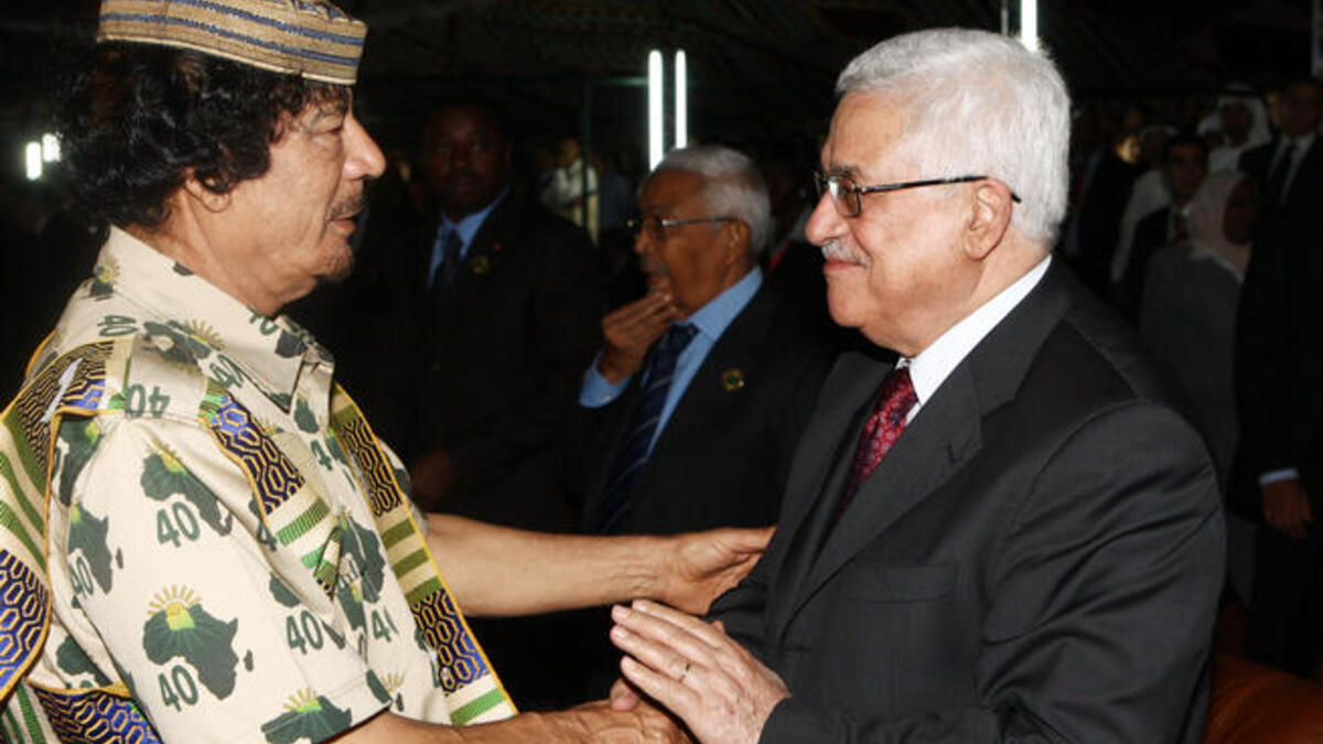 Palestinian President Mahmoud Abbas (R) greets Libyan leader Muammar Gaddafi on August 31, 2009 in Tripoli, Libya.  Libya is set for a week-long celebration to mark the 40-year anniversary of Muammar al-Gaddafi&amp;#039;s rise to power.