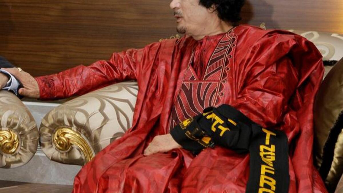 Bright colors and pomp: Gaddafi not one for making a quiet entrance: loves the spotlight, adopting an exaggerated almost pantomime dress style at times, confirming his reputation as eccentric and flamboyant.