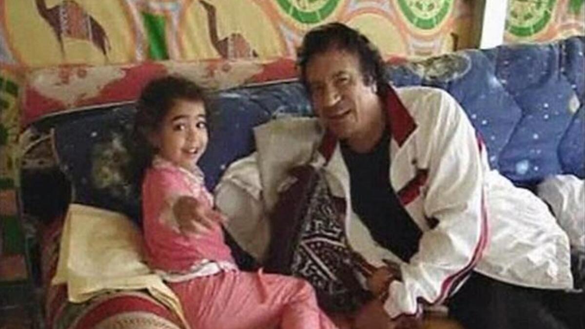When he's not fawning over Condy Rice, he's canoodling with this grandchildren. Much more befitting, to be sure, for 'good guy' 
Gaddafi promotion, this glimpse of the 
human, (less creepy) side of the Gaddafi 'zenga' man.