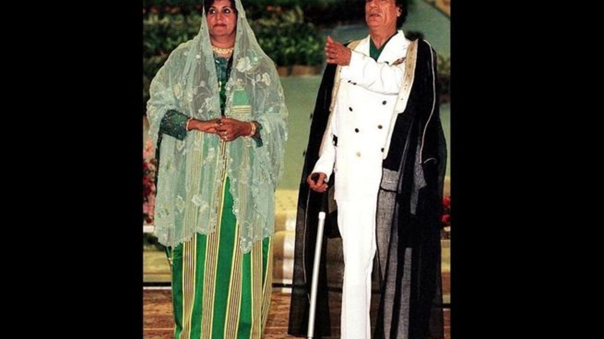 Husband and Wife pose for a Kodak moment, costumed out as always in readiness for the family album. Wife Safia was
last said to be in hiding with three of her children in Algeria.