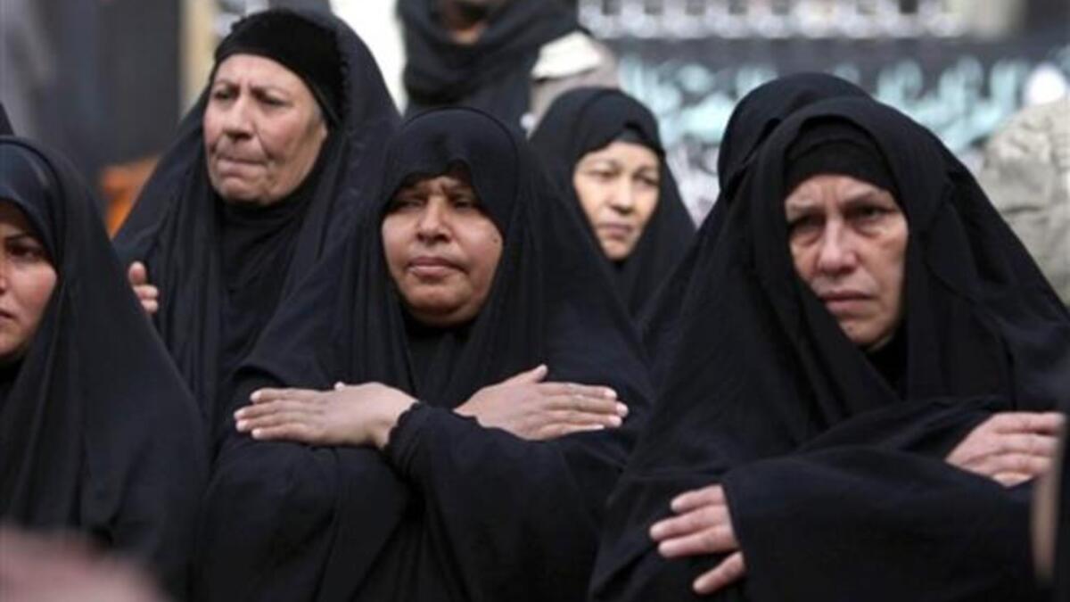Shiite Muslim shiite women beat their chests in an Ashura ritual in the shrine city of Karbala, as believers prepare to mark the religious event of Ashura 17 in commemoration of ten days of mourning for Imam Hussein, the grandson of Prophet Mohammed who was killed in the Battle of Karbala.