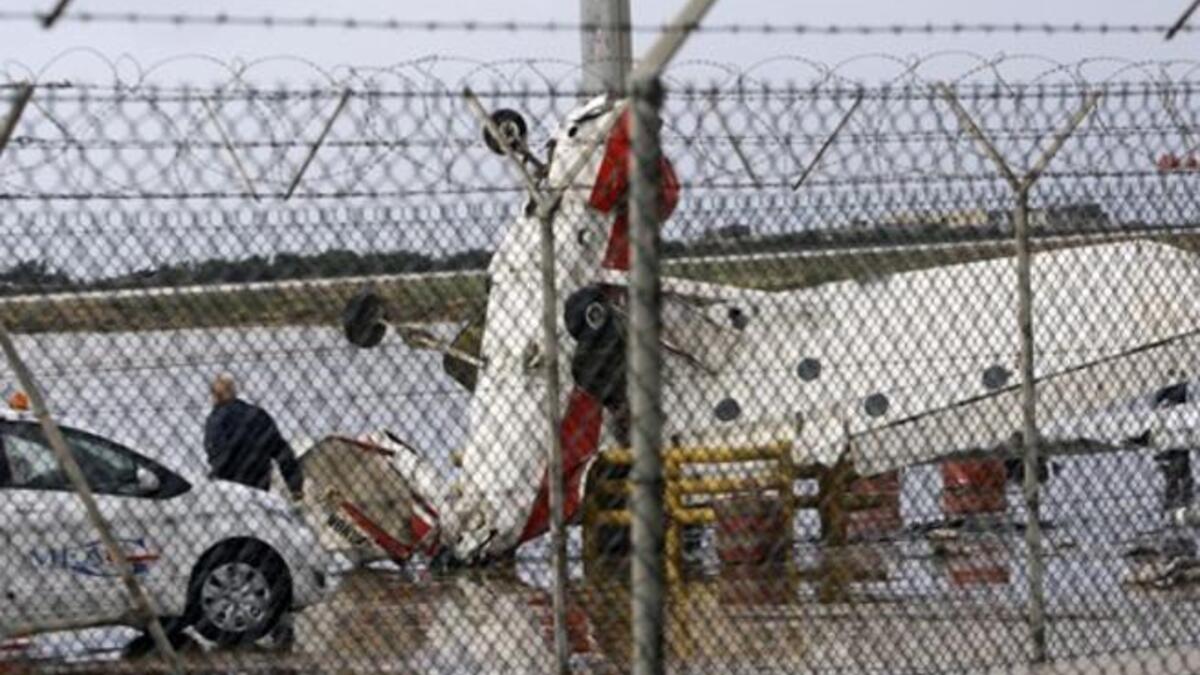 A damaged pilot training plane is pictured at the tarmac of Beirut international airport, as heavy winds topped 100 kilometres (60 miles) an hour.