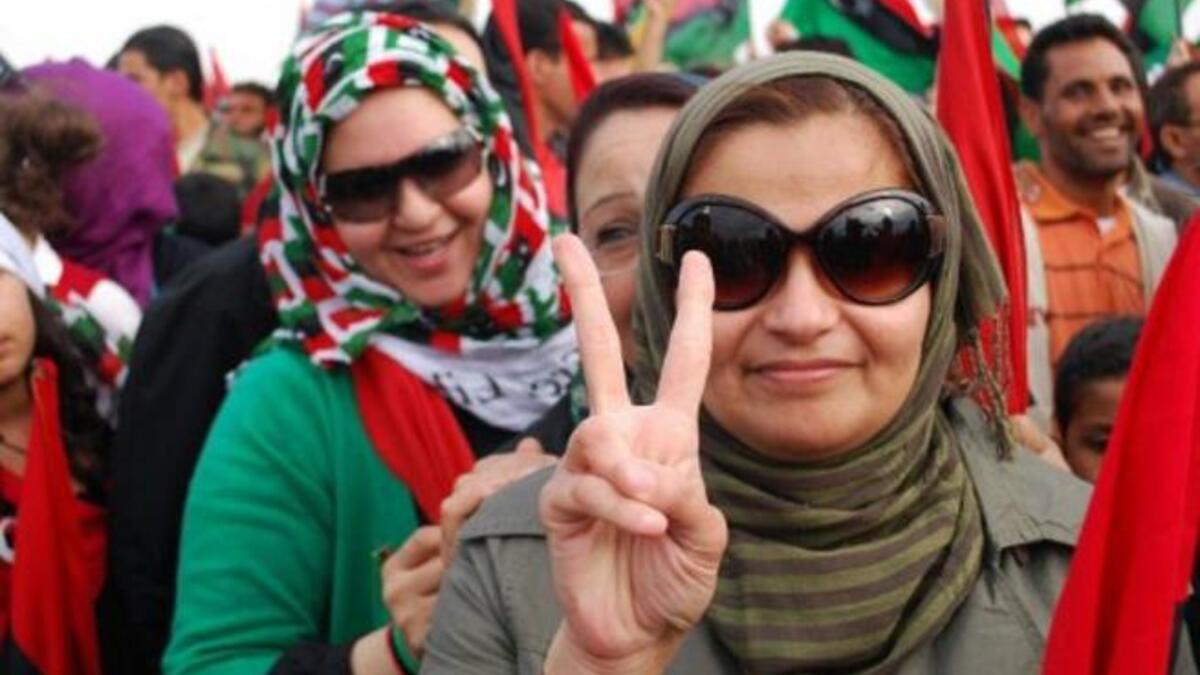 Thousands of Libyans celebrate during a ceremony announcing the liberation for the country in the eastern city of Benghazi. The 
mood is jubilant, and not even criticism about the nature of the death of Kadhafi is dampening anybody's revelry.