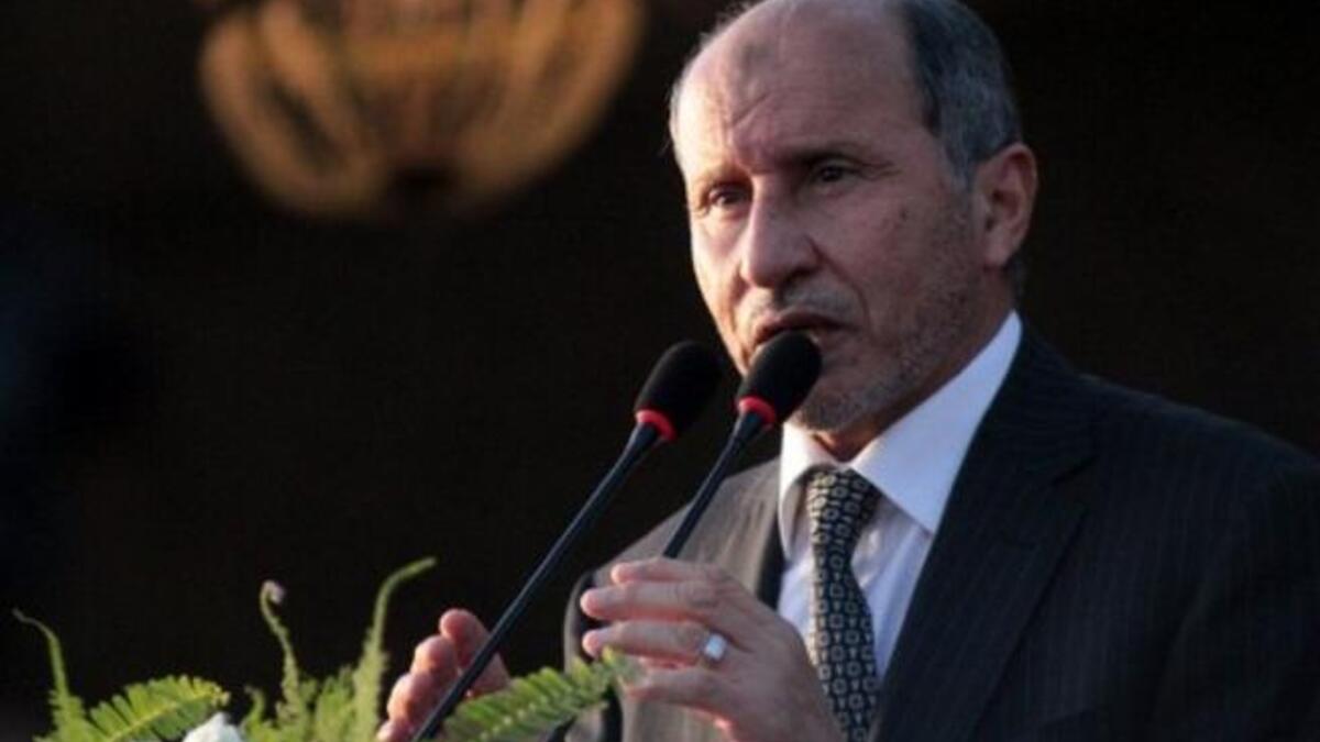 Libyan NTC leader Mustafa Abdul Jalil speaks during a ceremony announcing the liberation for the country. 
During a happy but somber speech in which he marked the heroic sacrifice of the dead fighters for Libya's freedom day, offering his sympathy for Turkey's earthquake victims, he hails the new age of peace, unity, and Islamic values.